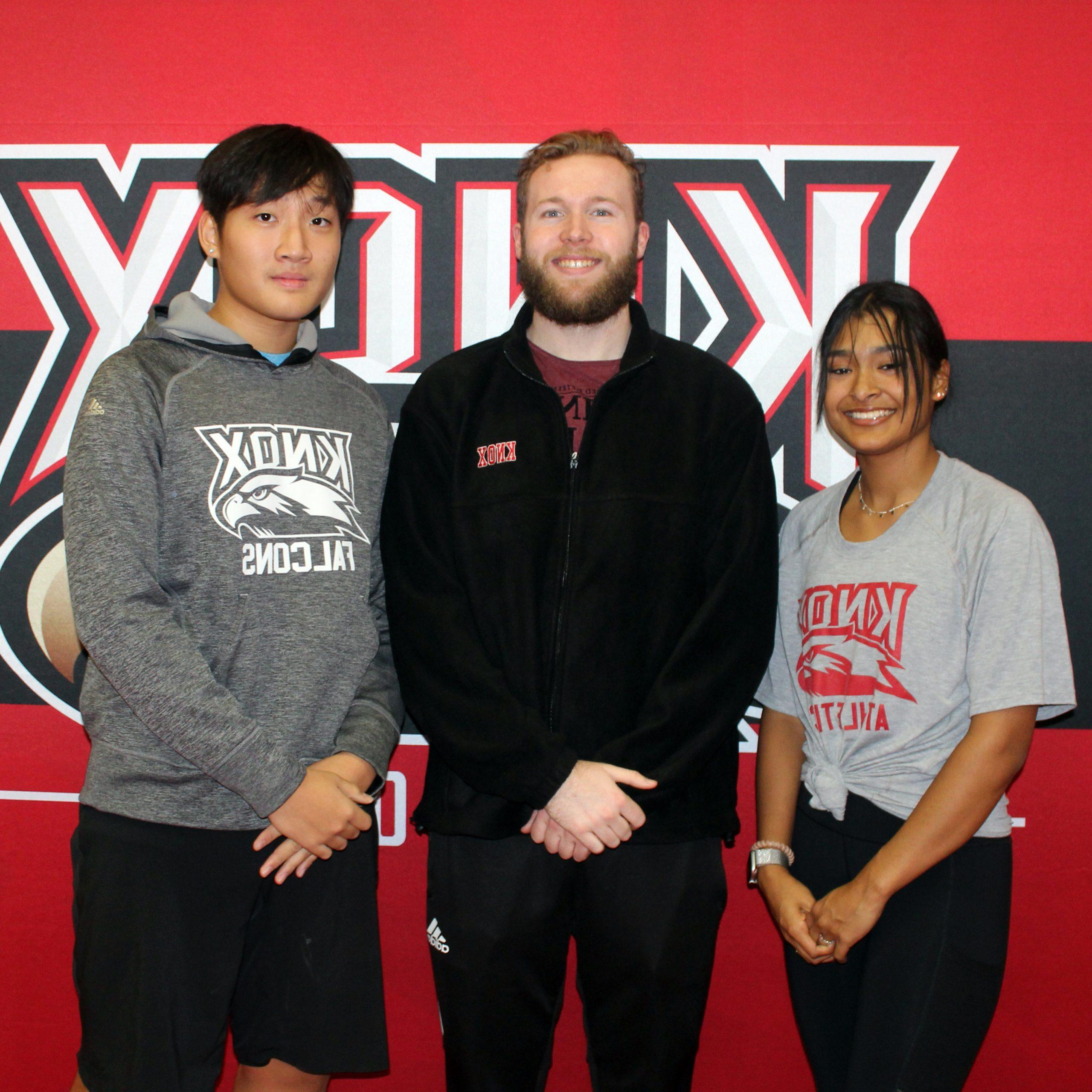 Image of Knox rowing coach and two student-athletes